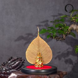 Lá bồ đề mạ vàng và tượng phật